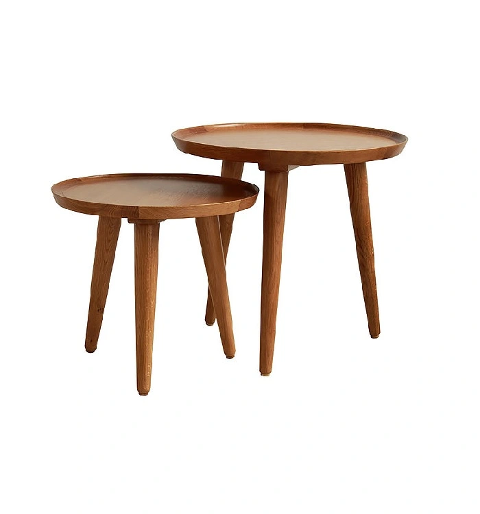 Teak round end table in a modern living room setting