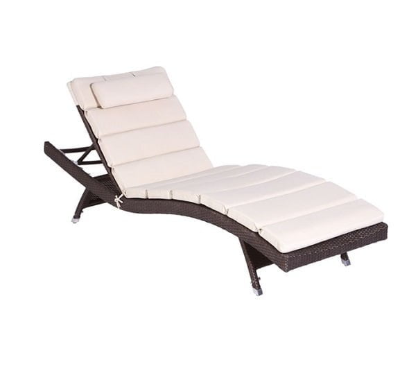 Wicker Wave Sun Lounger with an adjustable backrest in a garden